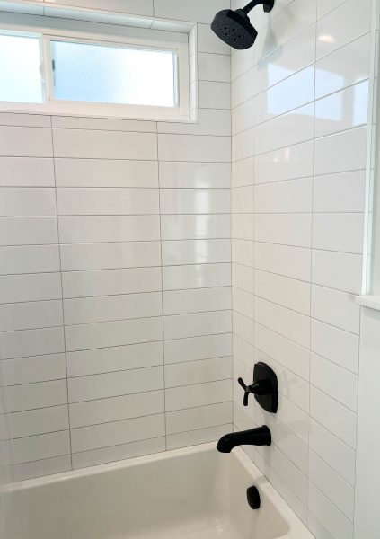 Matte-Black-Plumbing-Fixtures-with-White-Subway-Tile