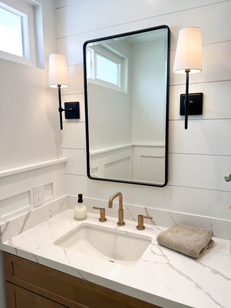 Wood-Toned-Bathroom-vanity-with-Mixed-Metal-Fixtures