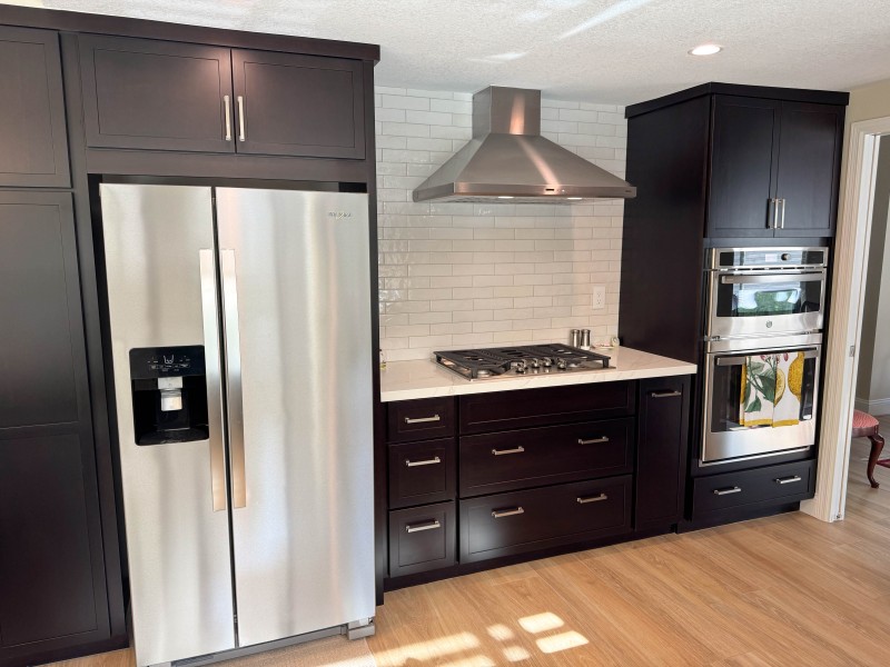 Dark-Wood-Tone-Cabinets-with-Light-Colored-Surfaces