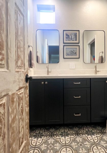 Navy-vanity-with-decorative-tile-flooring