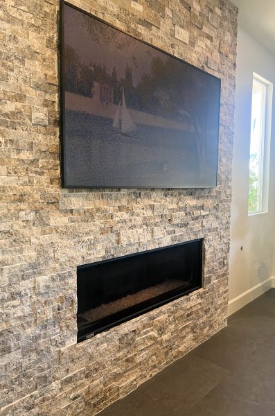 Stacked-Stone-Fireplace-with-Smart-TV