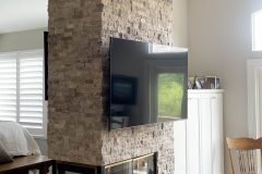 Floor-to-ceiling-stacked-stone-fireplace