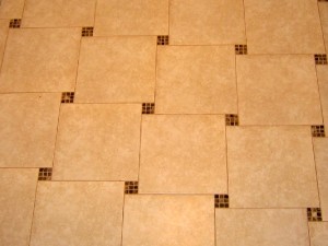 renovation contractor installed marble tile and small mosiac tile to create stairstep design