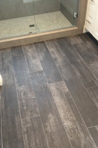 Orange County bathroom designers use faux wood ceramic tile to give warmth to bathrooms