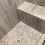 modern shower remodel includes shower seat