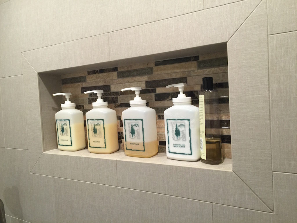 bathroom contractor incorporates storage in the shower with niches