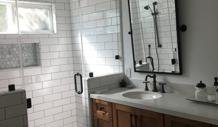 shower remodel matches black shower hardware to sink hardware