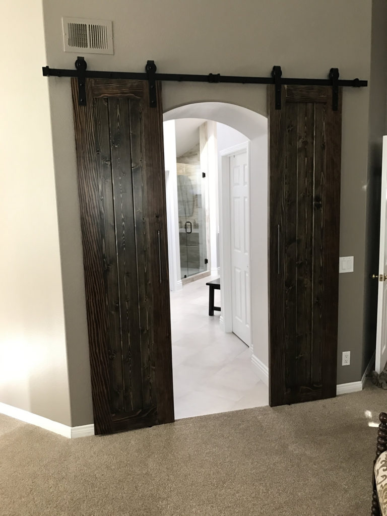 residential remodeling contractor adds barn doors as art