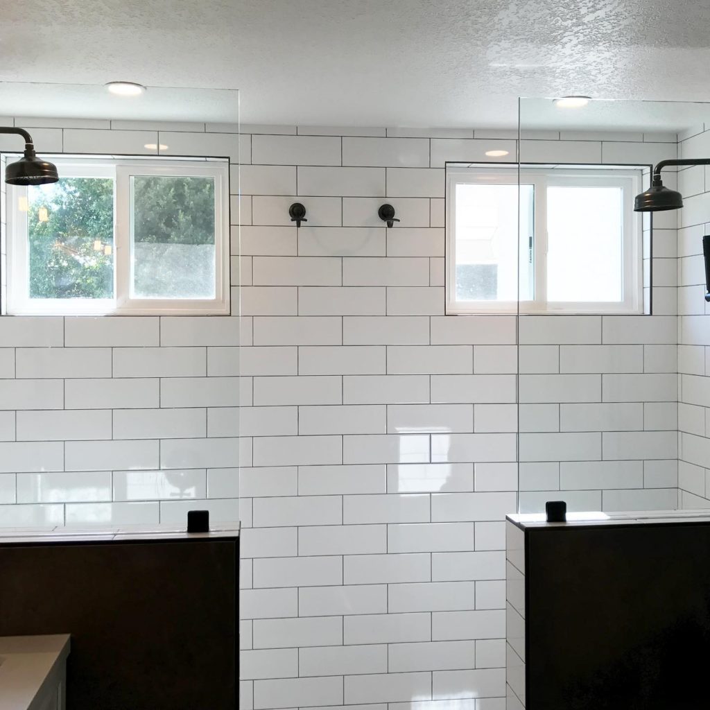 contractor uses classic H pattern for subway tile with contrasting grout