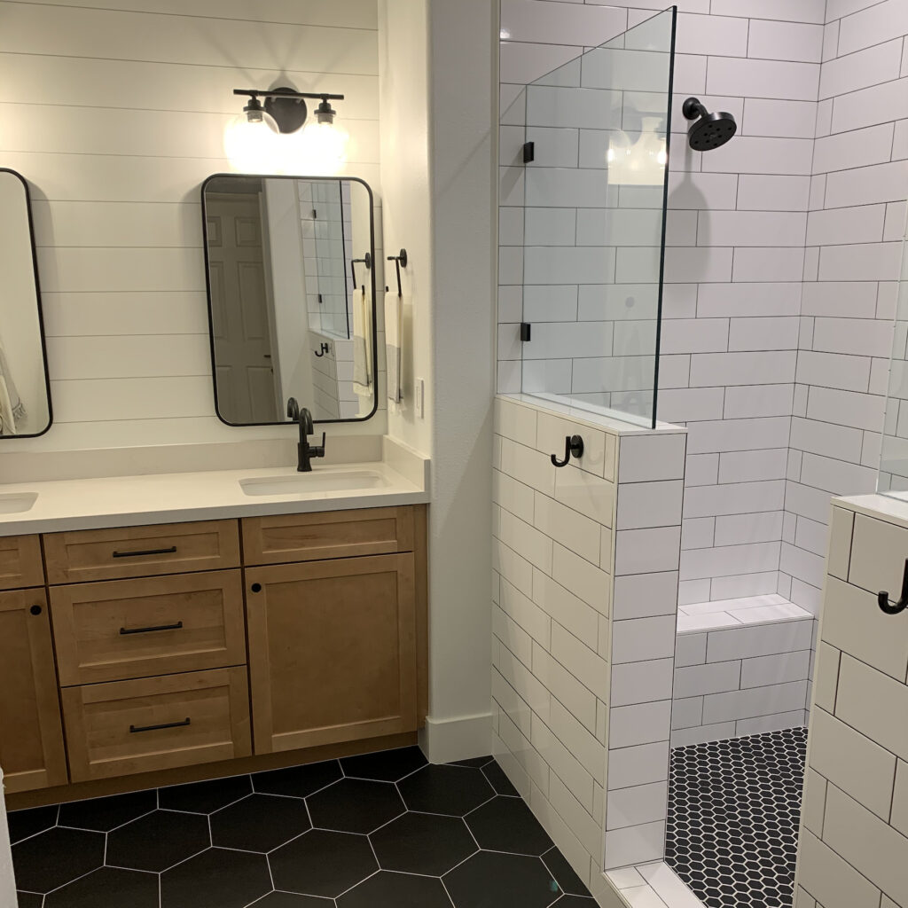 Orange county shower remodel with white subway tile and while and black grout to show contrast