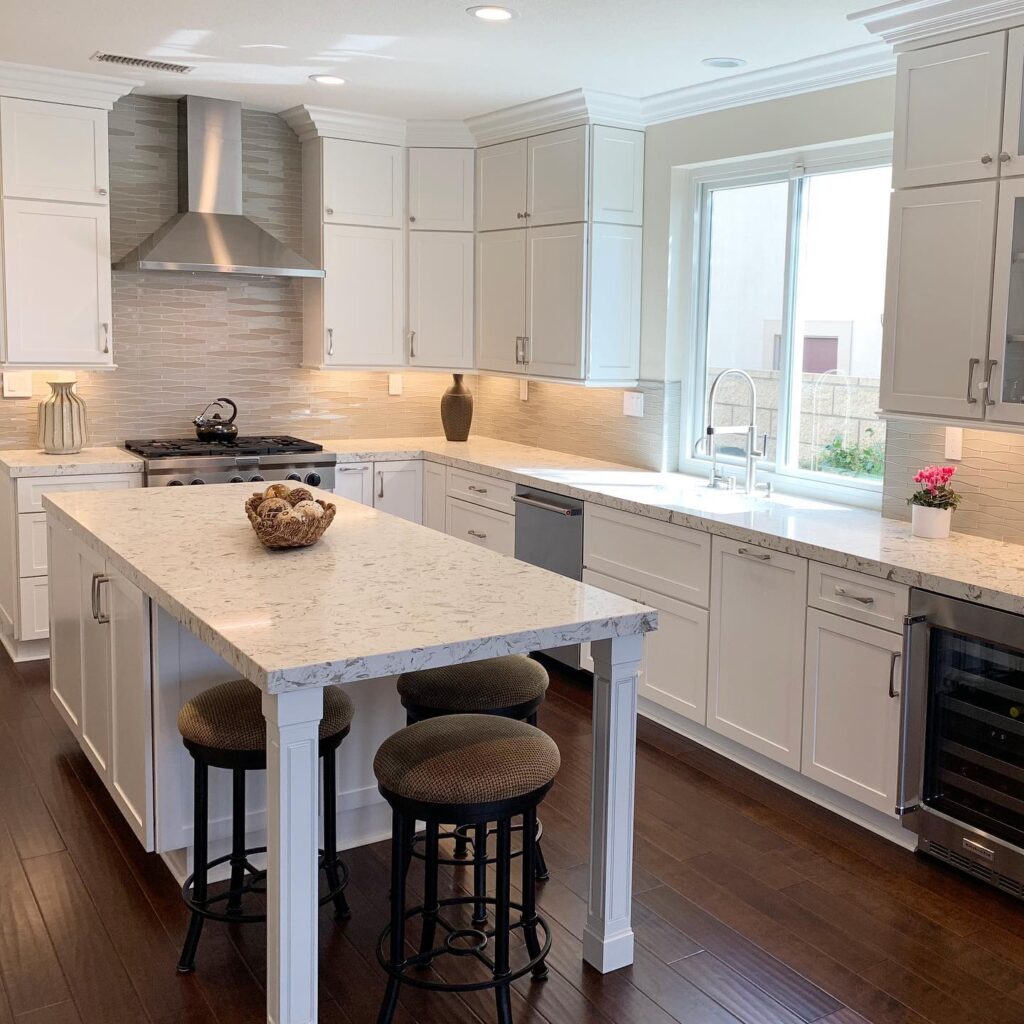 kitchen remodel company adds island with 3 bar stools to create eating space in a small kitchen