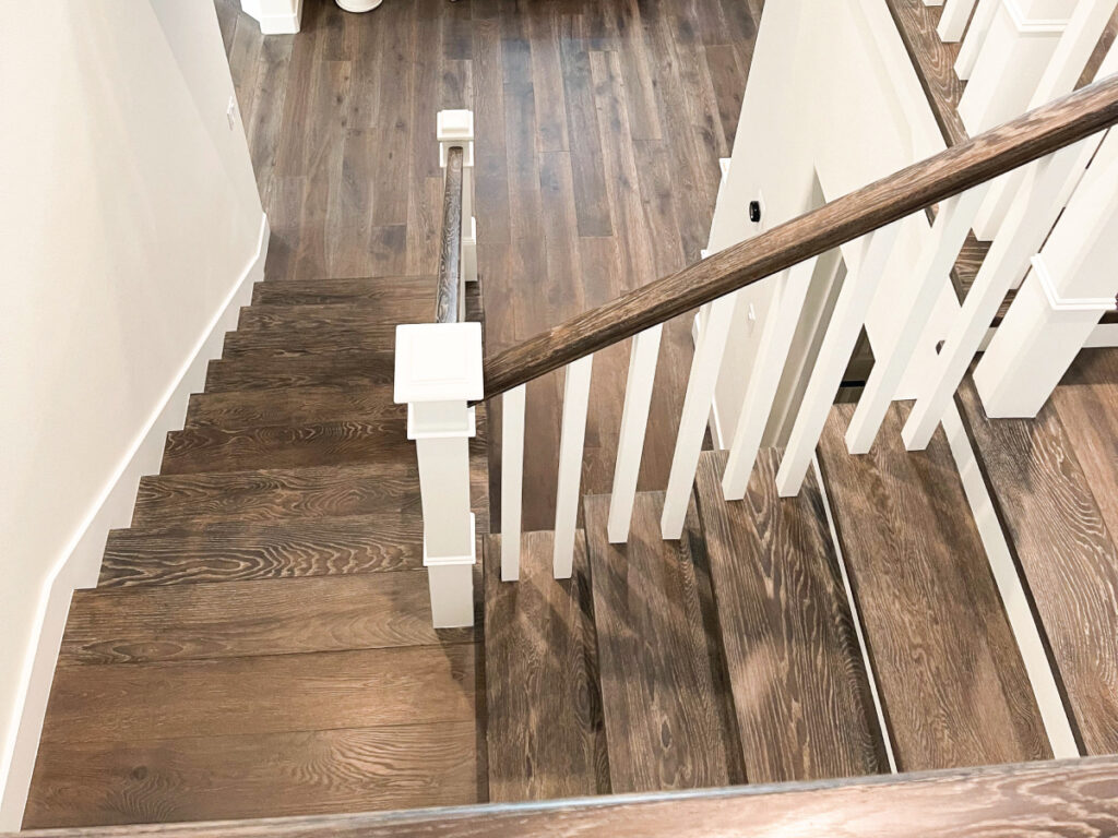 Flooring contractor after picture: Hardwood flooring on stairs and landing