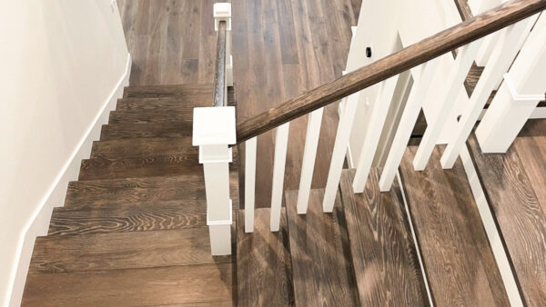 Flooring contractor after picture: Hardwood flooring on stairs and landing