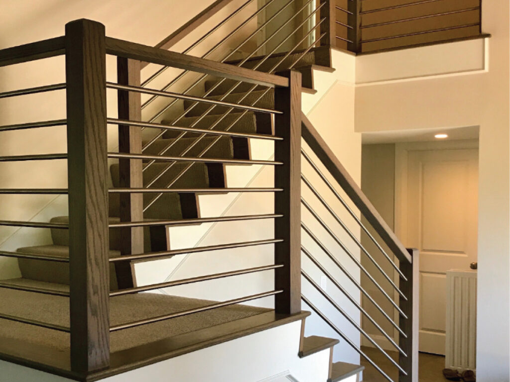 home improvement contractor after photo of Sstaircase with updated railings and metal ballusters