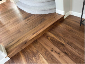 Orange County flooring contractor after photo engineered walnut hardwood flooring in hallway