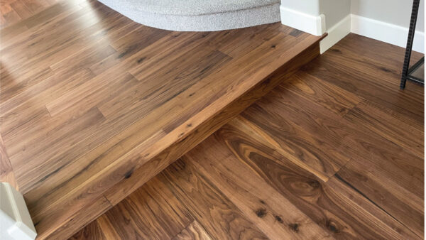 Orange County flooring contractor after photo engineered walnut hardwood flooring in hallway