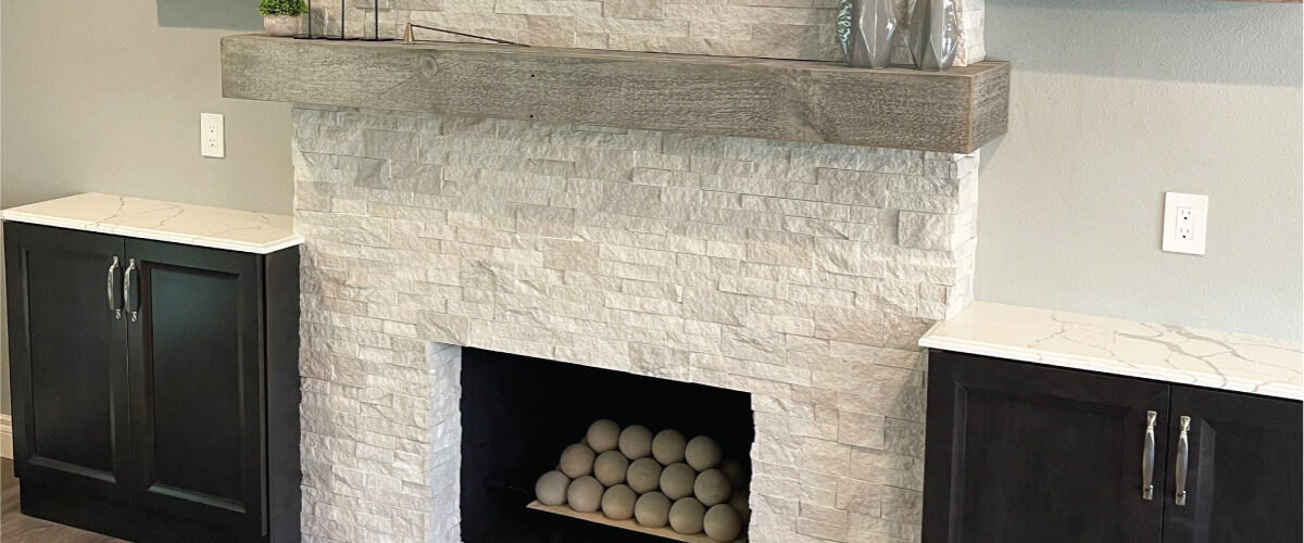 Fireplace with built-ins and stacked stone