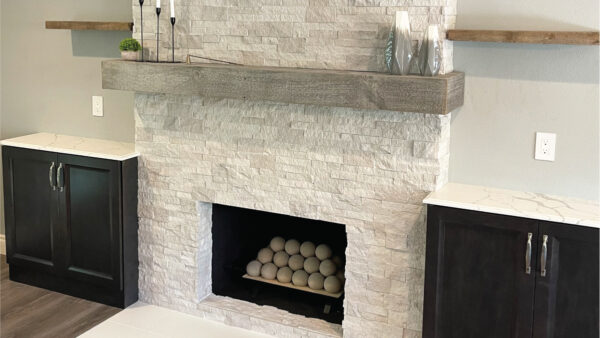 Fireplace with built-ins and stacked stone