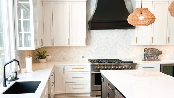 custom kitchen remodeling after showing Marble kitchen countertops with black and white cabinetry