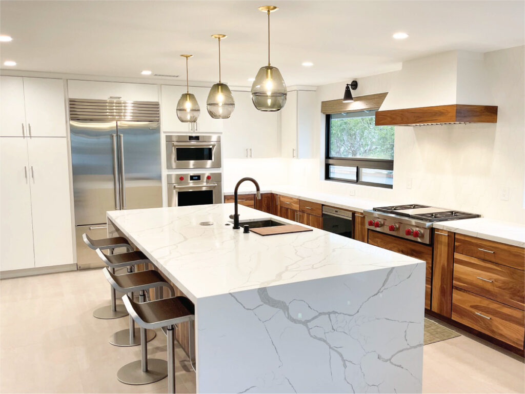 mid-century modern kitchen with marble look quartz and walnut cabinets