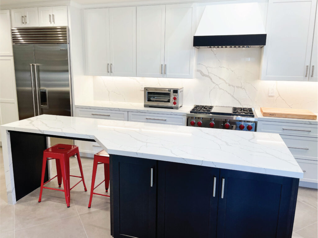 Modern coastal kitchen design with black and white cabinetry