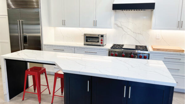 Modern coastal kitchen design with black and white custom cabinets