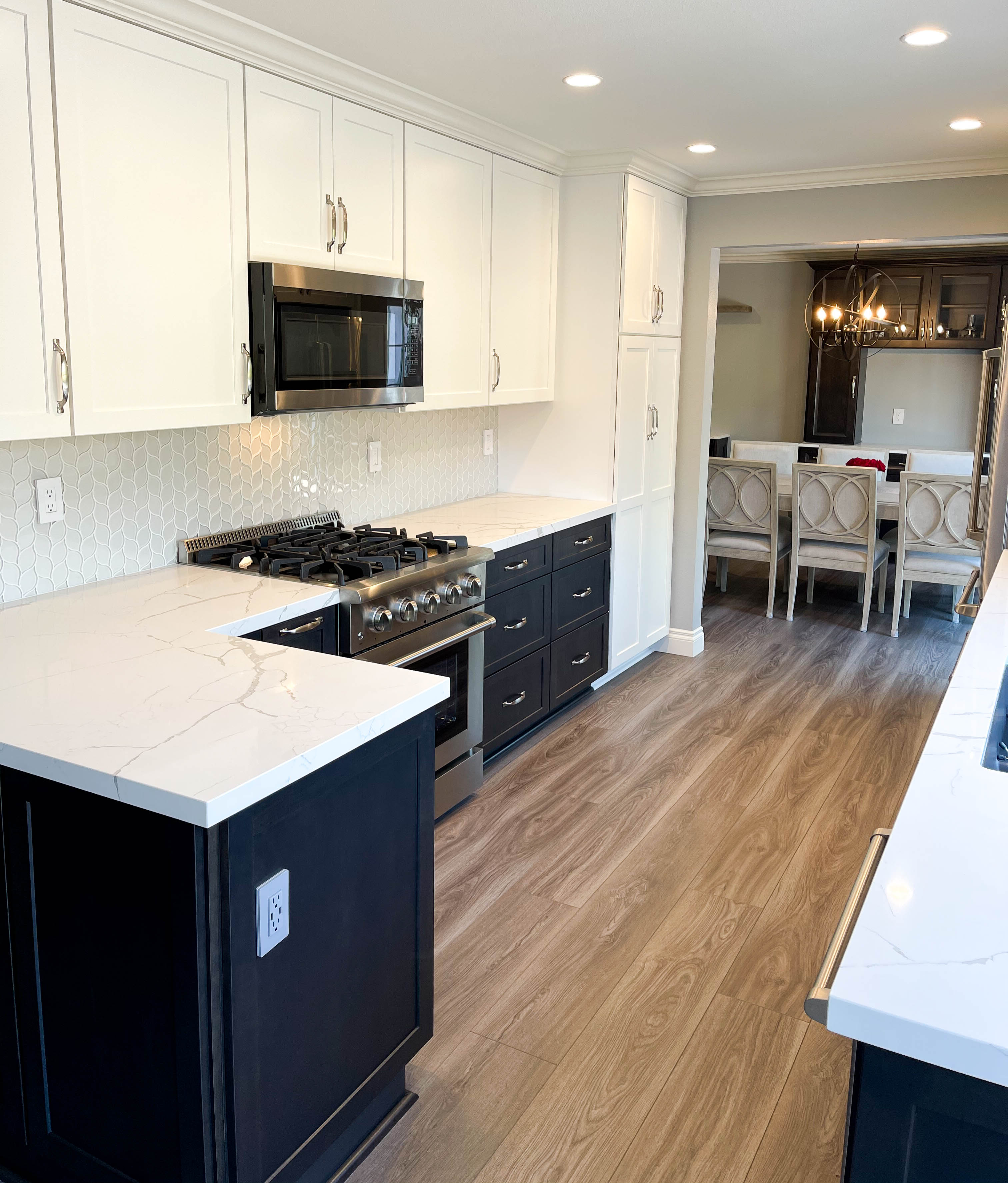 kitchen remodeling after with white upper cabinets and blue lower