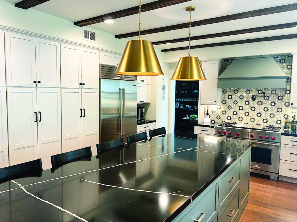 kitchen remodel after Green & white custom kitchen cabinets with black quartz
