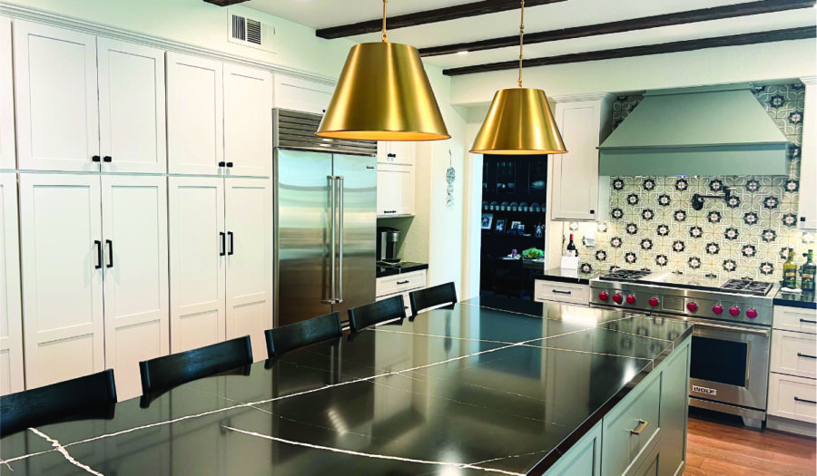 kitchen remodel after Green & white custom kitchen cabinets with black quartz