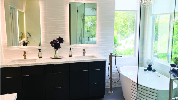 Modern master bathroom with slab front cabinets and white backsplash