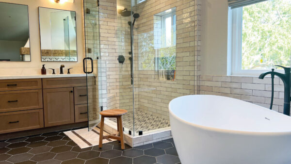 bathroom renovaction company after picture with frameless shower and soaking tub