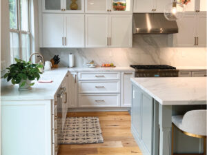 kitchen renovation with white cabinets and eat in island