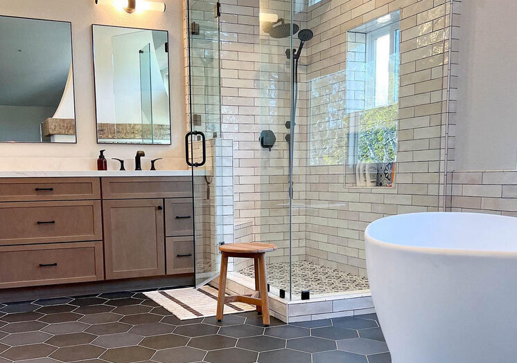 flooring contractor adds octagonal dark tiles on floor to contrast with light subway tile on wall