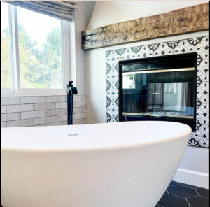 Orange county general contractor adds fireplace to San Clemente bathroom remodeling to match black and white theme