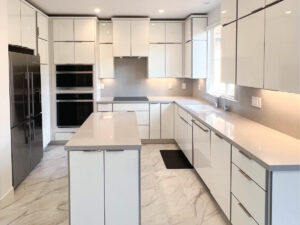 after Orange Copunty flooring contractor installs white stone floor in kitchen with white countertops