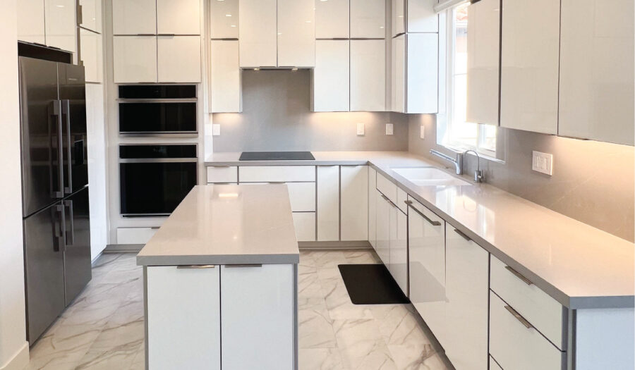 after Orange Copunty flooring contractor installs white stone floor in kitchen with white countertops