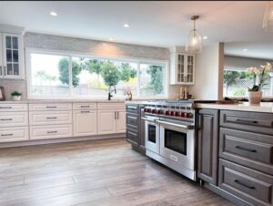 custom kitchen renovation after picture white and brown cabinets stainless steel appliances La Cabana windows