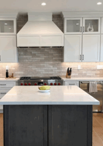custom kitchen remodeling after white custom range hood installed to match white cabinets