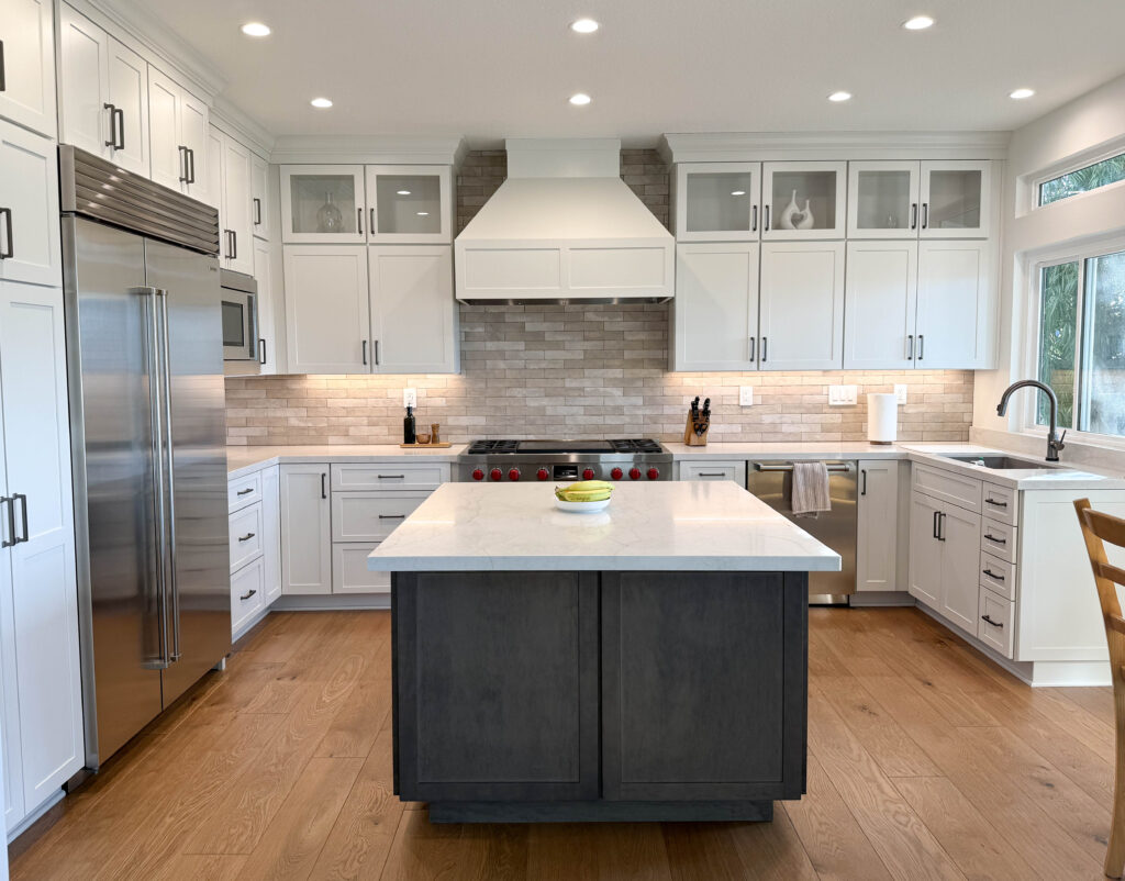 after kitchen remodel service dark cabinet island with white lower cabinets and white counters on both